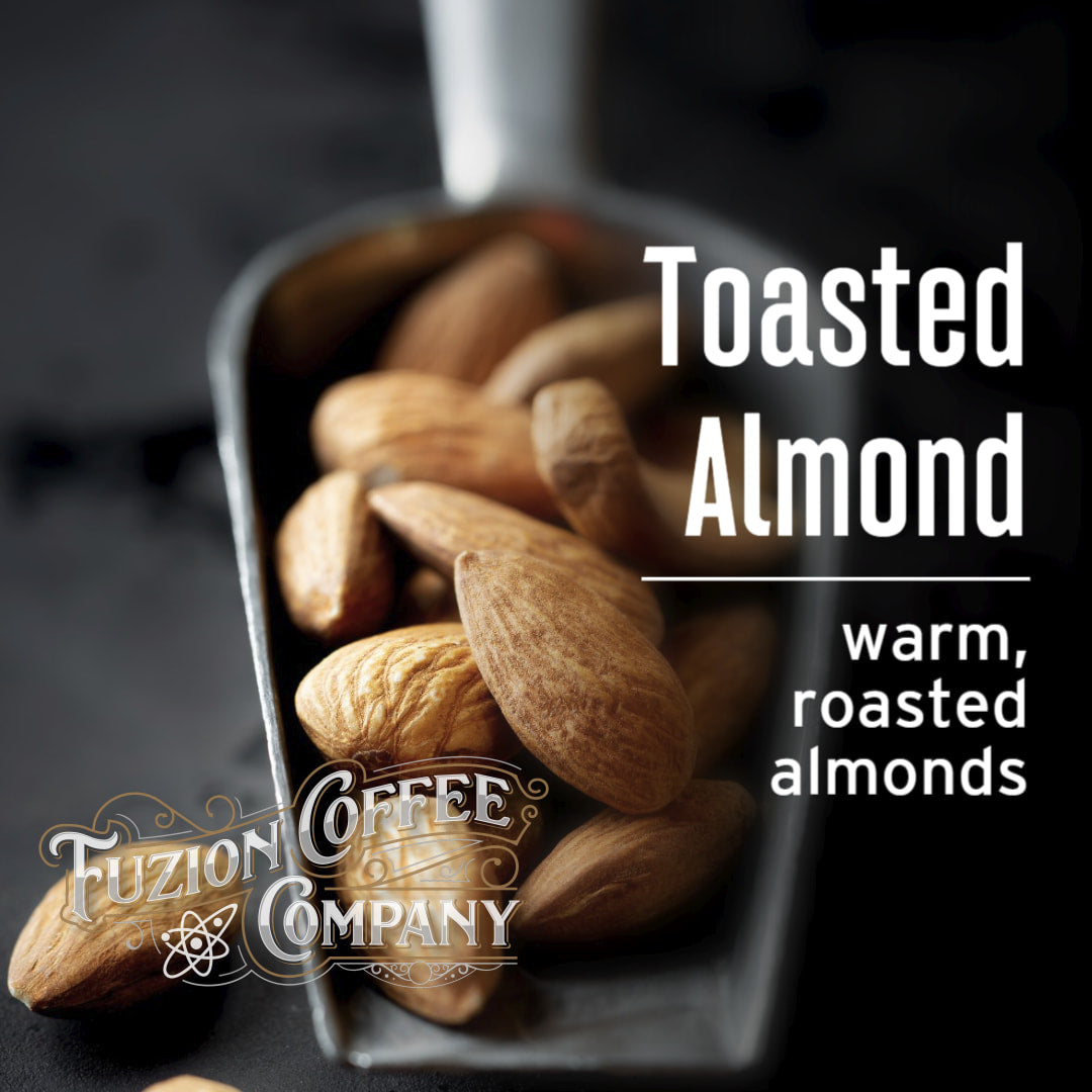 Toasted almonds in a scoop with Fuzion Coffee Company branding.